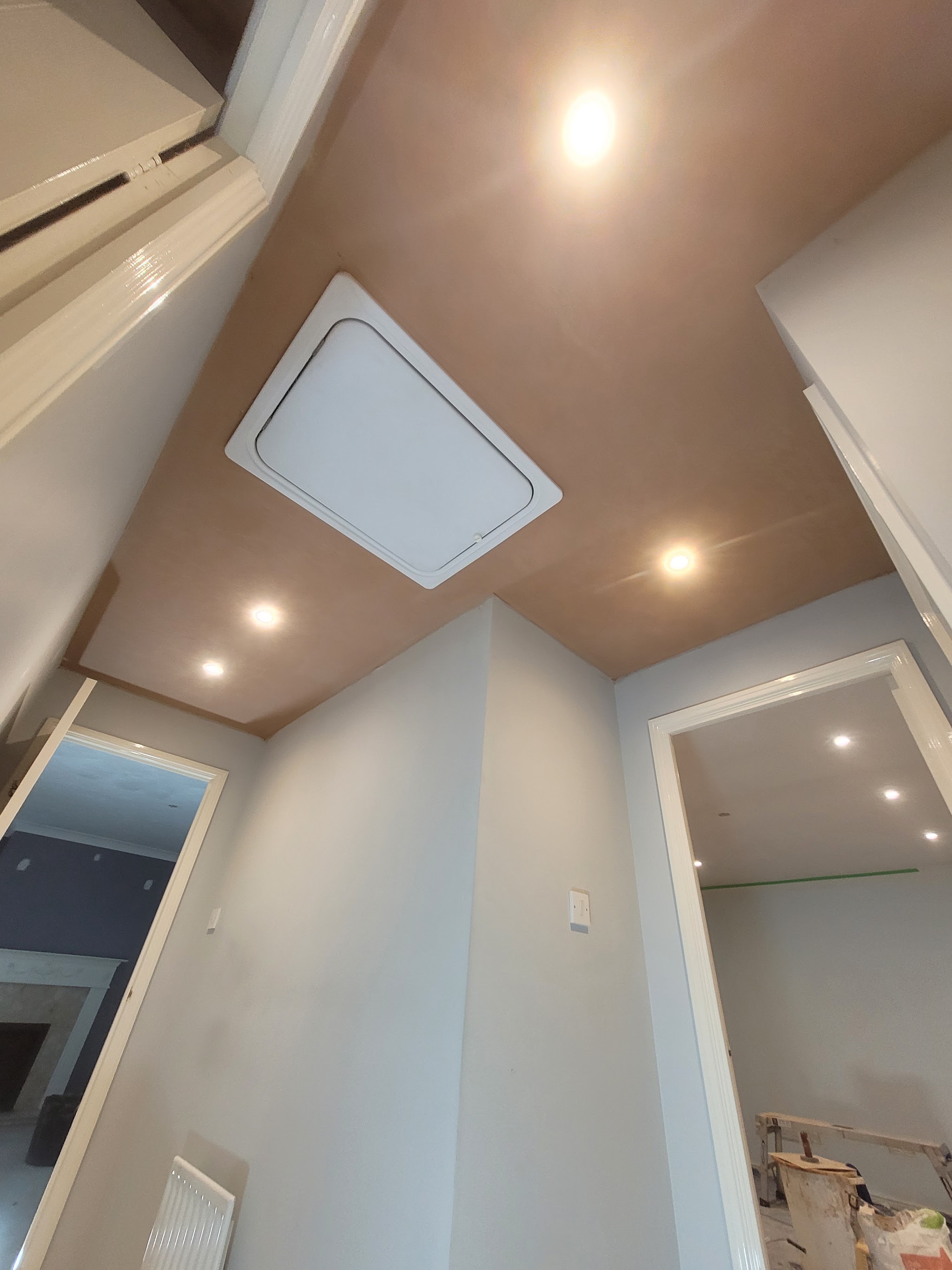 Landing with a smooth skimmed ceiling, loft hatch and downlights