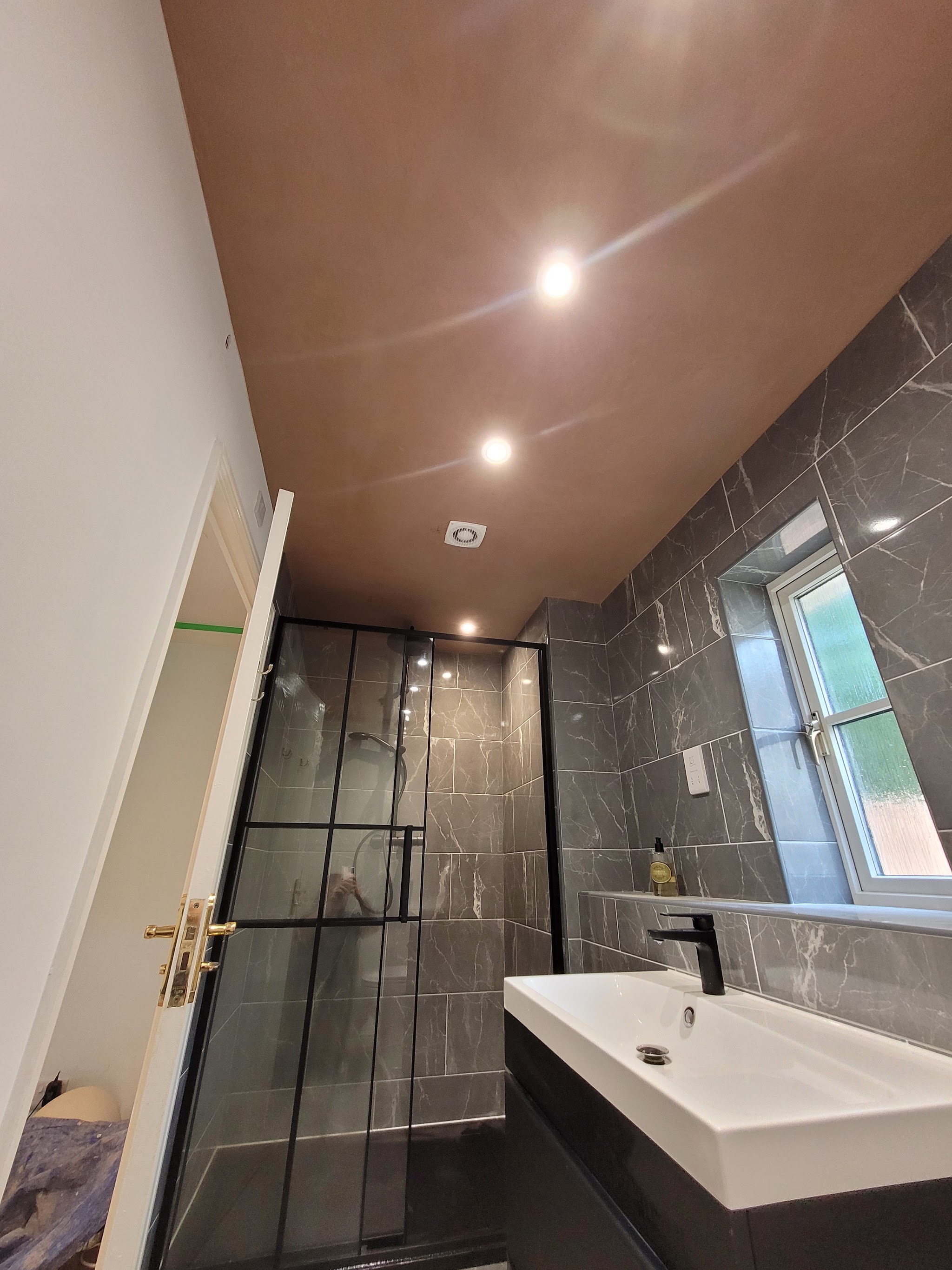 Finished bathroom with a smooth skimmed ceiling, downlights and a walk-in shower